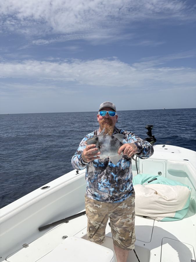 Guest with a catch on a reef trip off the Space Coast