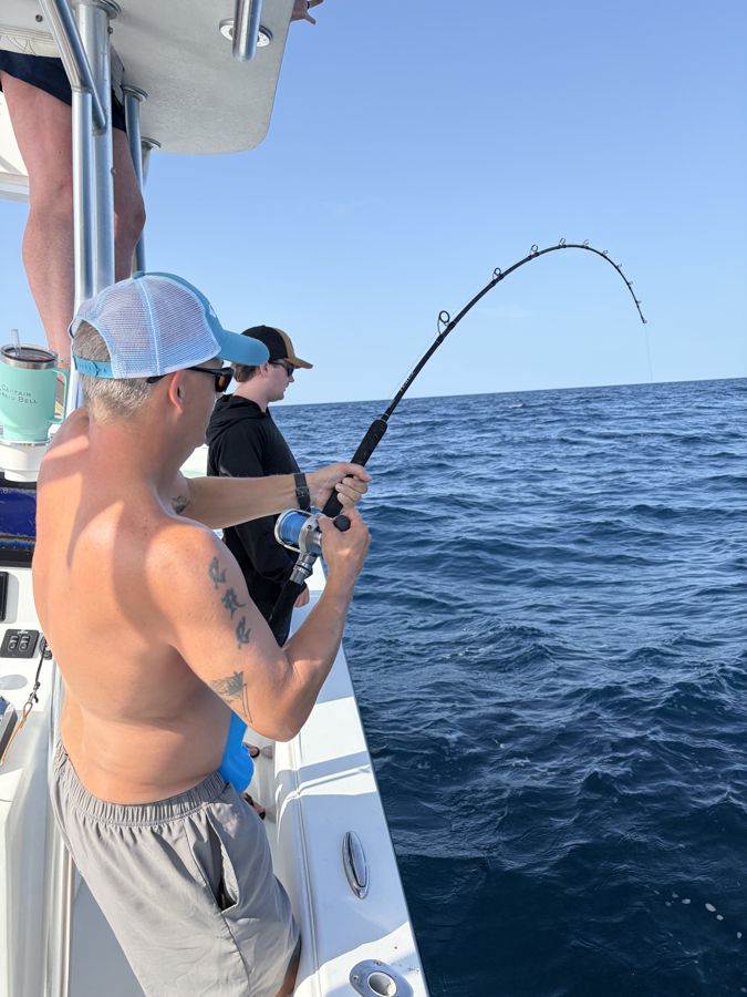 Rod bent on a near-shore reef charter